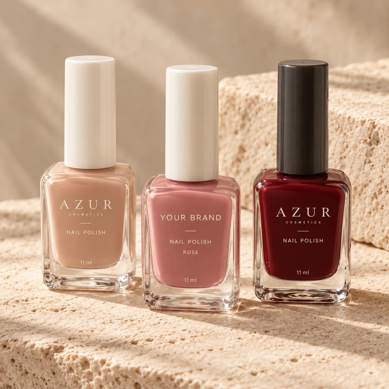 Nude, rose and burgundy nail polish in rectangular glass bottles with Azur and Your Brand packaging